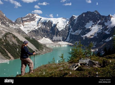 Hiker High Above Lake Of The Hanging Glacier Purcell Mountains