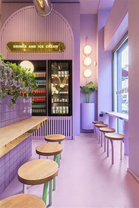 A New Restaurant Uses A Colorful Green And Purple Interior To Draw