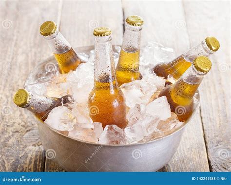 Cold Bottles Of Beer In Bucket With Ice Stock Photo Image Of Beverage