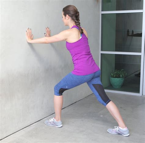 How To Do A Standing Calf Stretch Popsugar Fitness