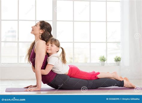 Young Mother And Daughter Doing Yoga Exercise Stock Image Image Of