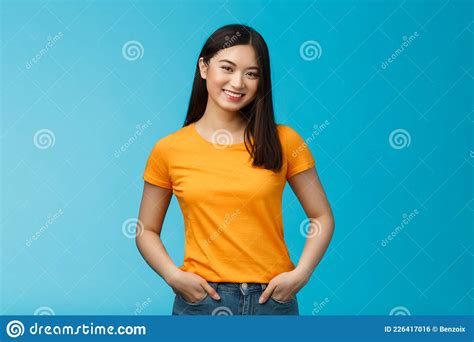 carefree friendly asian girl with short dark hair tilt head lovely smiling camera hold hands