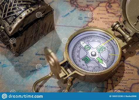 A Fragment Of An Old Map With A Compass And An Old Chest In The