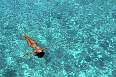 Woman In Bikini Enjoying Clear Sea Water Stock Photo Dissolve