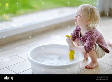 Little Toddler Girl Helping Her Mom To Clean Up Stock Photo Alamy