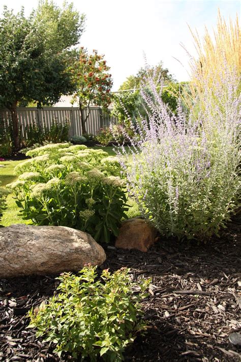 A Beautiful Bungalow Landscaping Backyard Plan Including Flower Garden
