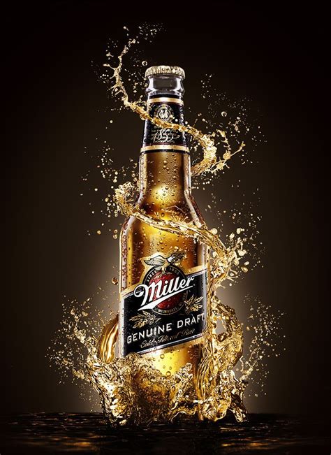 A Bottle Of Millers Beer Is Splashing Out Of The Water On A Black
