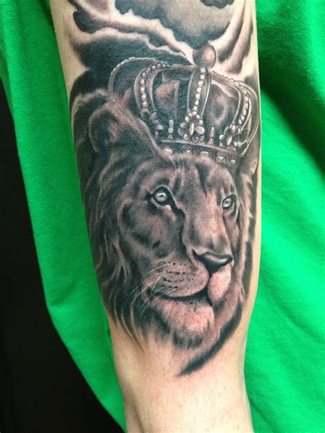 Lion head with moon tattoo. Lion crown tattoo www.mkeink.com done by Jim Francis ...