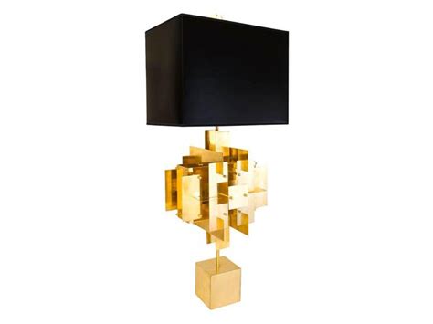 Inspired by a house of cards, jonathan adler's puzzle table lamp is made of sheets of solid brass layered in a dynamic composition, topped with a moody matte black shade. 6 Luxury Lamps to Illuminate Your Home