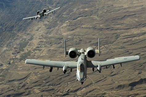 Two A 10 Thunderbolt Iis Fly A Close Air Support Mission Over