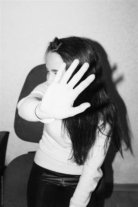 Young Woman Hiding Her Face From The Camera By Danil Nevsky