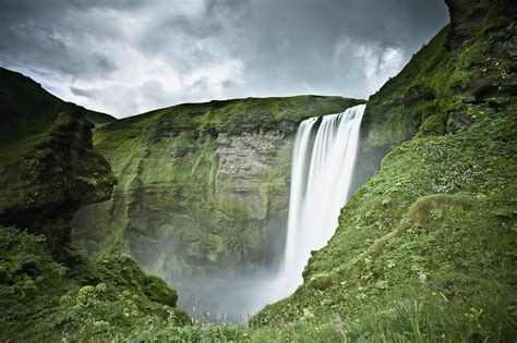 A Waterfall Over A Grassy Cliff Photograph By David Duchemin Pixels