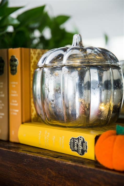 The vintage vibes of the irregular, crackled, and spotty glass are a lovely addition to a tablescape or mantel. DIY Mercury Glass Pumpkins | HGTV