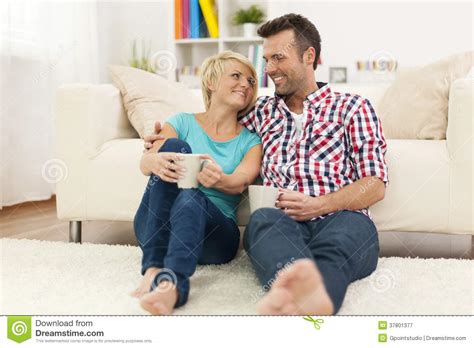 Relaxed couple at home stock image. Image of affectionate - 37801377