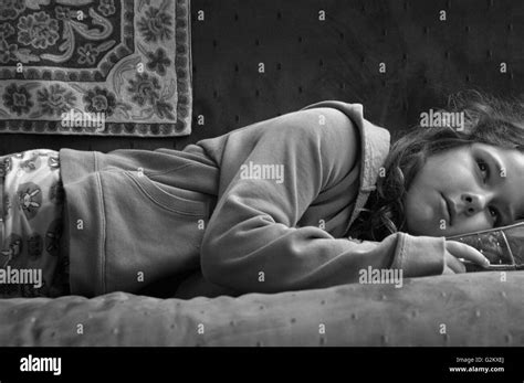 Girl Laying On Couch Stock Photo Alamy
