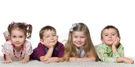Four Children Lying On The Carpet Stock Photo Image Of People
