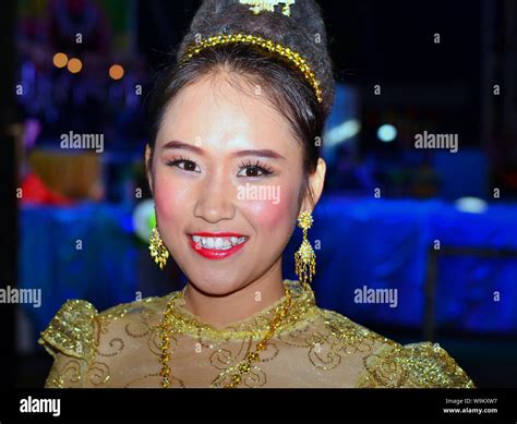 Dressed Up Thai Girl Wears A Golden Lanna Style Lace Dress And Elaborate Hairdo With Hair
