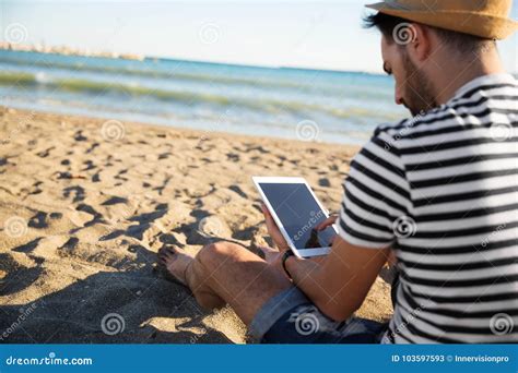 Man Sitting On Beach Reading Ebook Stock Image Image Of Looking Person
