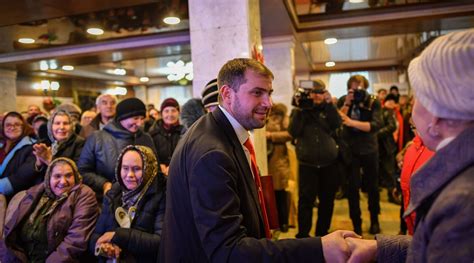 Moldovan oligarch, wanted at home in billion-dollar scandal, backs