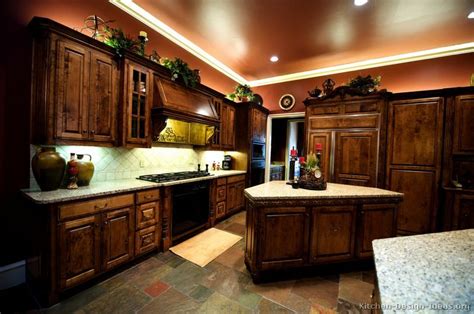 Another popular kitchen light style is track lighting, which typically features multiple fixtures that you can angle in different directions. Pictures of Kitchens - Traditional - Dark Wood Kitchens ...