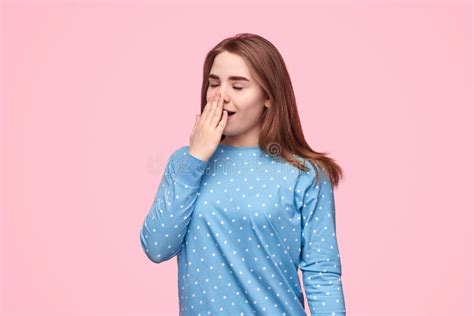Sleepy Teen Girl Yawning And Covering Mouth Stock Photo Image Of Cozy