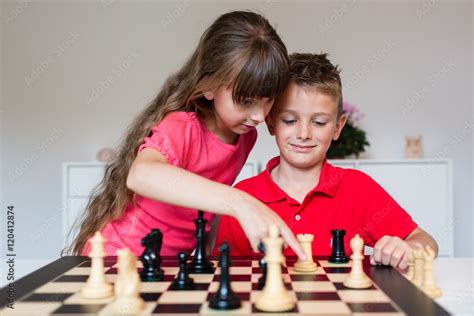 Foto Stock Children Playing Chess Adobe Stock