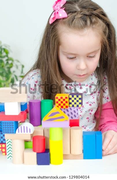 Little Girl Playing Building Blocks Stock Photo 129804014 Shutterstock