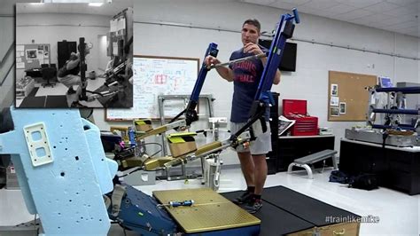 Astronaut Mike Demonstrates The Ared Space Fitness Machine Nasa