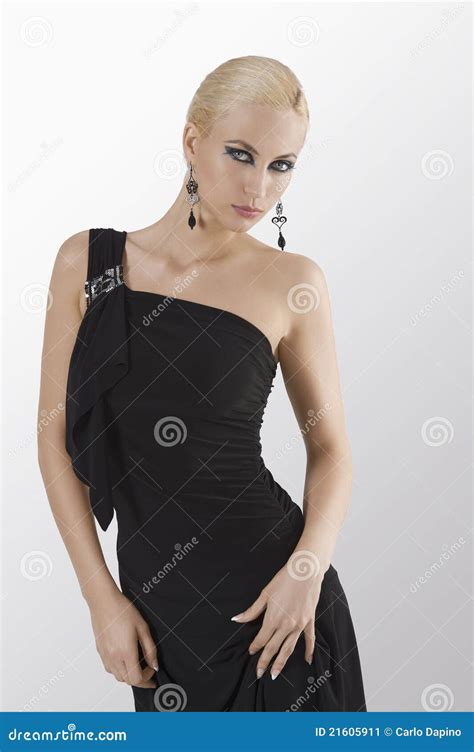 Blond Girl In Black Dress Posing And Holding Stock Image Image Of