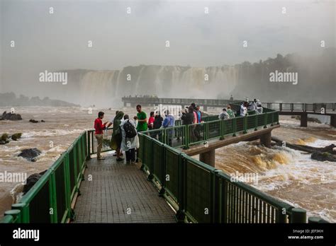 Tourists Over A Walkway Iguazu Falls Foz Do Iguaçu Brasil Stock Photo