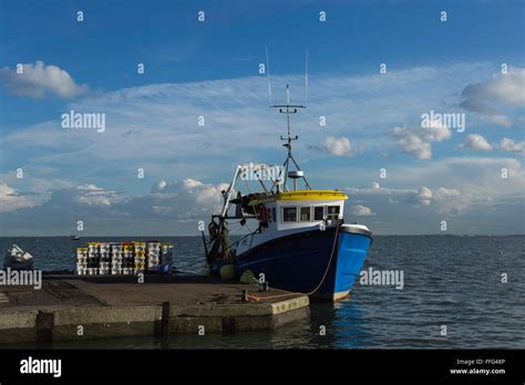 Fishing Boat Moored At Bell Wharf Old Leigh With Stacked Fish Boxes