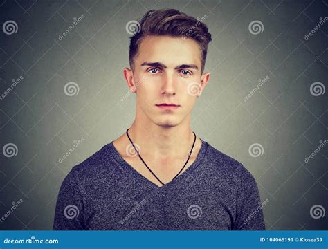 Portrait Of A Serious Young Man Looking At Camera Stock Image Image