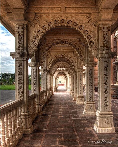 An Ornate Walkway With Columns And Arches