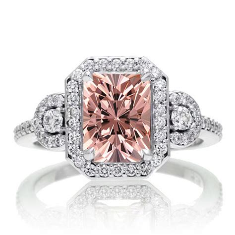 2 Carat Emerald Cut Morganite And White Diamond Halo Engagement Ring On
