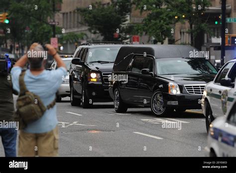 A hearse arrives at the Cathedral Church of Saint John the Devine where