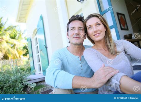 Middle Aged Couple Sitting In Their Garden Stock Image Image Of Forties Adults 47990561