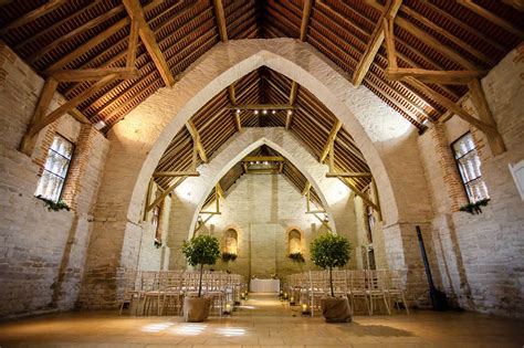 This separate area within the barn looks out into the fields as the sun sets. Tithe Barn Wedding Photography | Kerry Morgan Photography