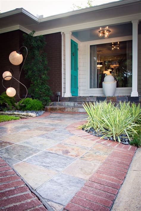 Consider building a pergola around a section of your walkway to create visual. Ceramic tile and brick walkway leads visitors to the front ...