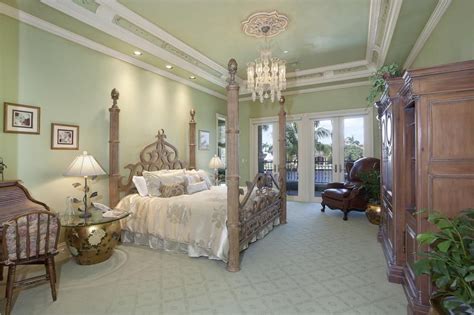 This awe inspiring country master bedroom would not be complete without the crown molding. 60 Primary Bedrooms with Tall Ceilings (Photos)