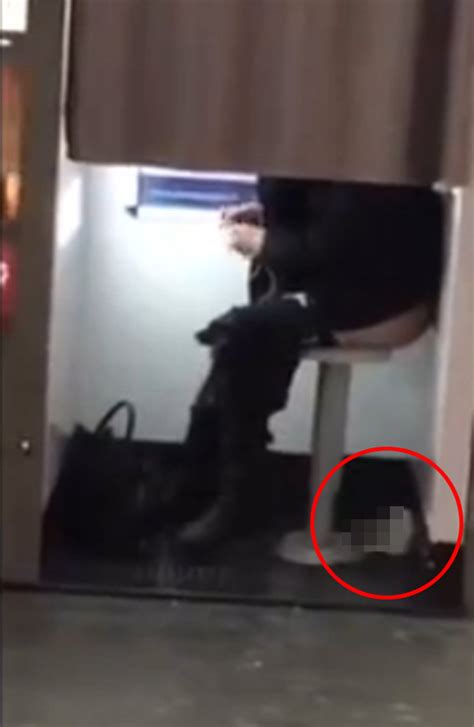 Watch Young Woman Caught Taking Poo In Train Station Photo Booth