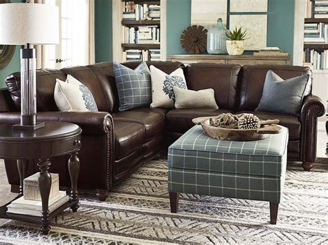 The classic dark brown leather sofa has served as a stereotypical focal point in the living room for decades. Hand Rubbed Sectional In Brown Leather | Brown living room ...
