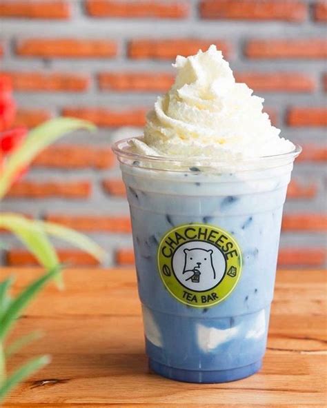 A Blue Drink With Whipped Cream On Top