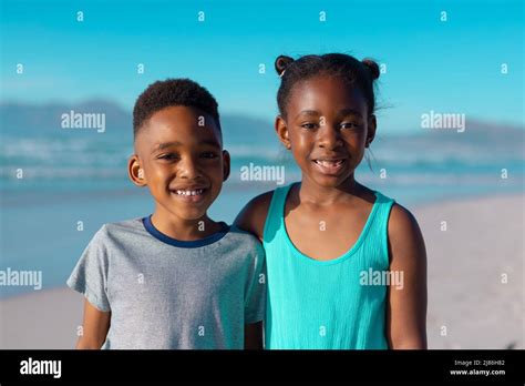 Portrait Of Smiling African American Brother And Sister Standing