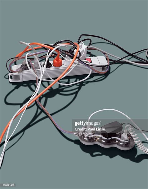Tangled Electrical Cords Plugged Into Power Strips High Res Stock Photo
