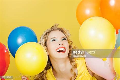 beautiful woman with balloons photos and premium high res pictures getty images
