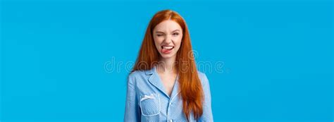 Sassy And Excited Good Looking Redhead Female In Nightwear Winking