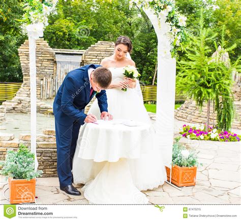 Couple Getting Married At An Outdoor Wedding Ceremony Stock Image Image Of Bouquet Groom