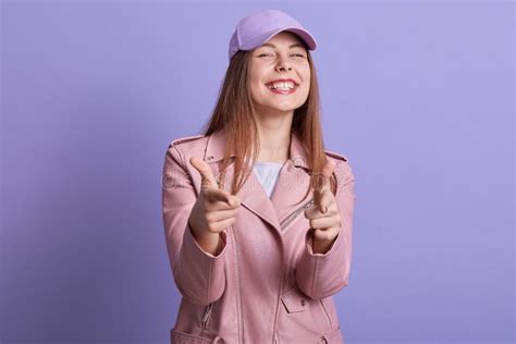 Indoor Portrait Of Cheerful Emotional Young Girl Making Gesture