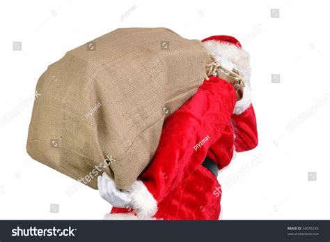 Santa Claus Carrying Big Sack On His Back Full Of Christmas Presents