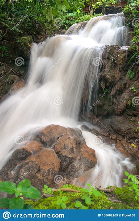 Beautiful Silky Smooth Waterfall And A Rock Used A Slow Shutter Speed